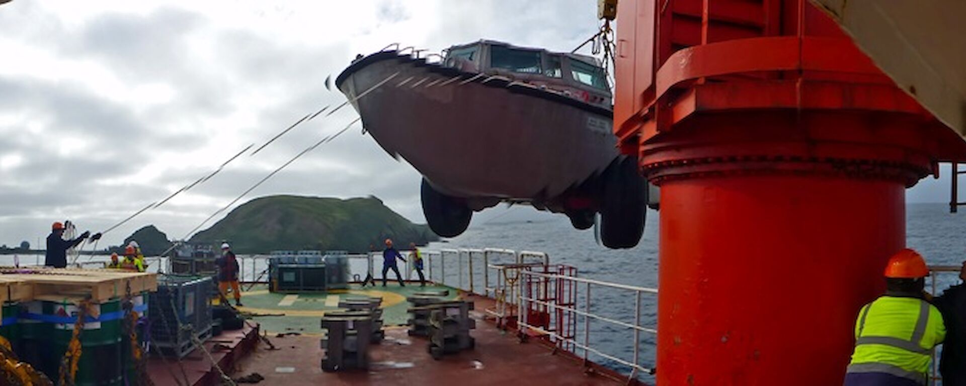 A LARC amphibious truck is unloaded from the ship