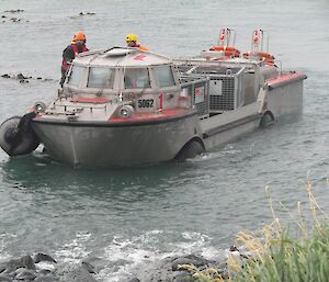 A LARC is seen sailing toward the beach