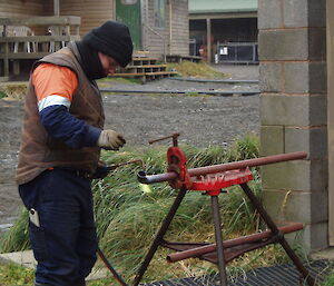 A plumber welding a new pipe