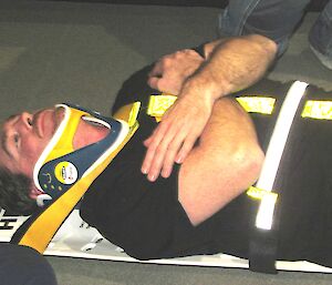 Expeditioner is restrained on spinal board
