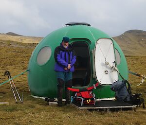 Expeditioner at water tank hut