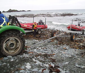 Boat being launched off trailer into water