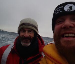 Greg and Ian in their boat