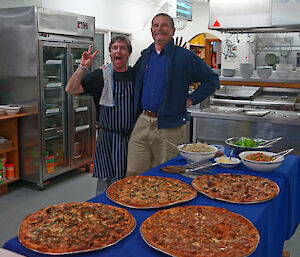 The chef and station leader celebrate their fine work in the kitchen