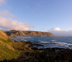 View of the west coast of Wireless Hill at North Head, island plateau in the distance