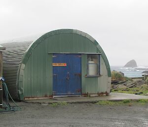 Recreation hut — a green tin building with a curved roof and double doors
