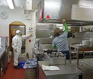 Chef Benny (in suit) and plumber Greg cleaning the kitchen extractor filters