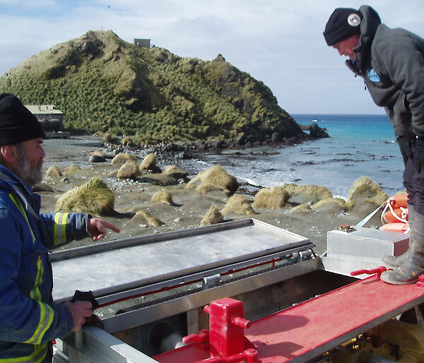 Pete briefs Chris on the engine compartment of the LARC