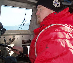 Chris at the helm at sea