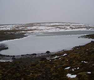 Frozen lake at the top of Heartbreak Hill