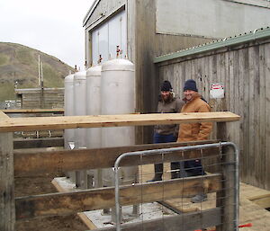 Sean and Krzysztof at the new gas cylinder storage area installed as part of the upgrade