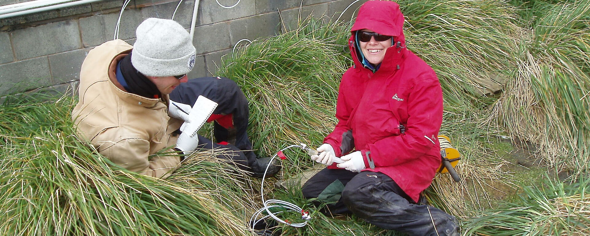 Ben and Lisa collect groundwater samples from a sampling point on station