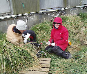 Ben and Lisa collect groundwater samples from a sampling point on station