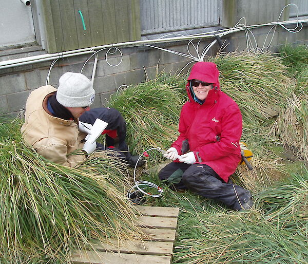 Ben and Lisa collect groundwater samples from a sampling point on station