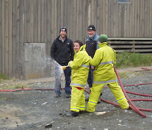 Expeditioners doing fire hose training
