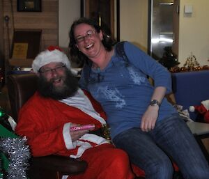 Santa and female expeditioner smiling