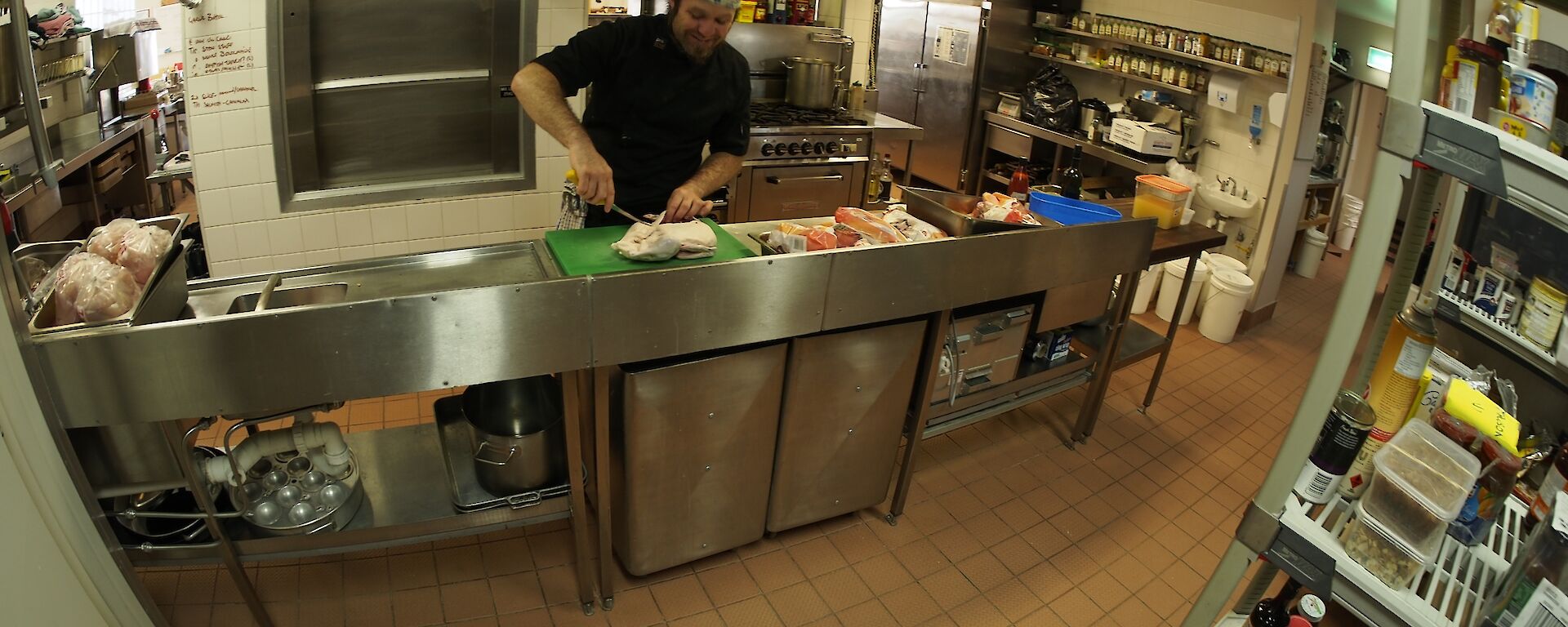 The chef in his kitchen preparing the dinner