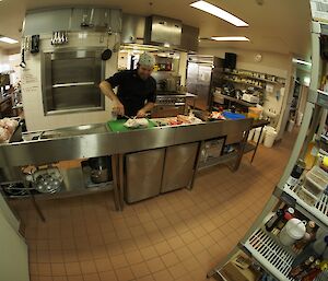 The chef in his kitchen preparing the dinner