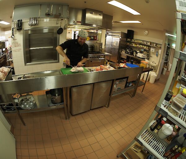 The chef in his kitchen preparing the dinner