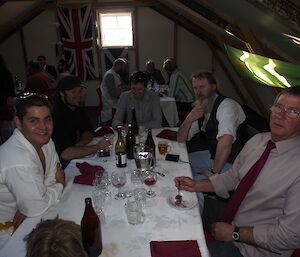 Five expeditioners sitting at a table during the dinner