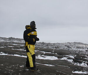 A biologist fully clothed with balaclava and googles for the blizzard conditions