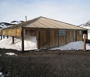 Discovery Hut — an old wooden hut surrounded by snow