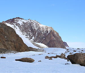 Mt Elliot’s west face, snow on ground and on parts of the rocky mountain