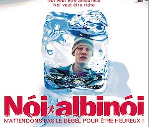 Film poster for Noi Albinoi showing a man juxtaposed in front of a beach scene