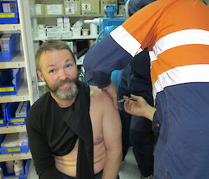 Pete C receives an injection in his arm