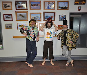 Fancy dress quiz contestants — three expeditioners line up in costume for a photo