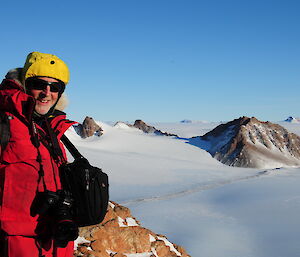 Masson Range from up high with expeditioner smiling on left