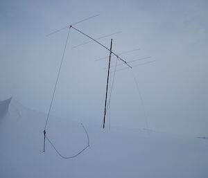 Antenna for moon bounce radio signal surrounded by piles of snow