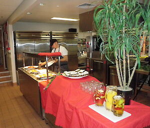 Mawson mess and chef filling a bain marie dish