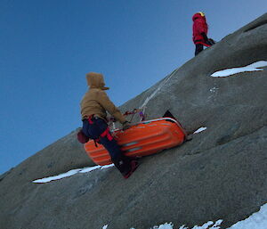 Mawson SAR exercise — Patient and attendant on the way up the cliff via rope and a successful recovery