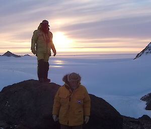 Craig and Lloyd on rocks with sun and ice in background