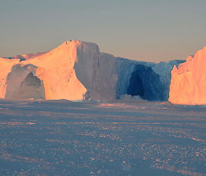 Caves in ice cliff