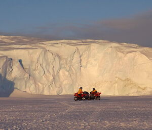 Expeditioners on quads on the sea ice