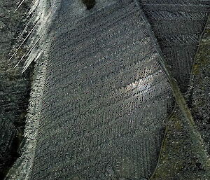 Ice crystals form in a mosaic pattern that almost looks like woven fabric