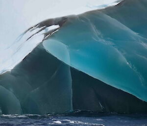 A large jade iceberg photographed from the water showing two shades of jade intersecting — stunning
