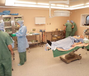 Surgical and anaesthetic assistants prepare for theatre