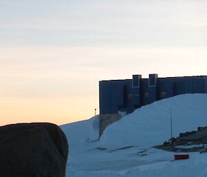 Mawson power house — a blue storage container building surrounded by snow