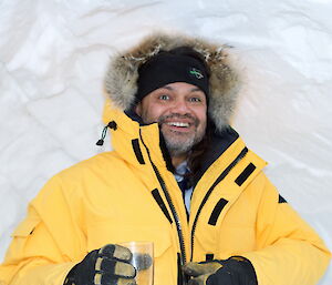 Cliff Simpson-Davis surrounded by snow and wearing a large winter coat
