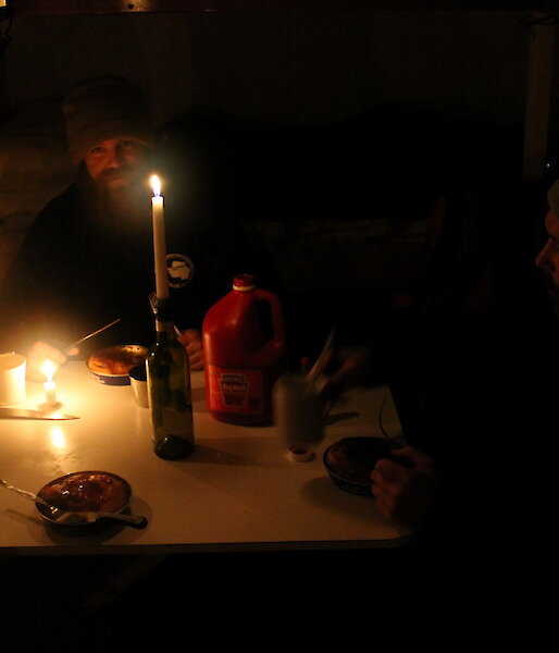 Dinner at field hut — Jeremy and Peter C tucking into freshly baked Fray bentos pies.