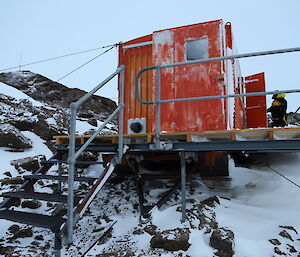 Henderson Hut is secured to the ground with cables.