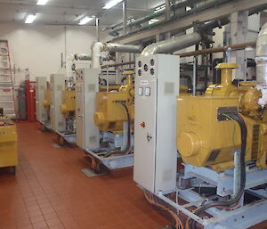 Mawson Powerhouse egine rooms with huge yellow machines.