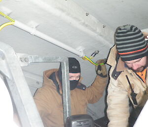 Electricians working on generator