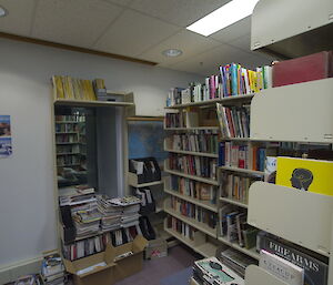 Mawson Library packed with shelves laden with books.