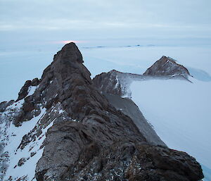 Rumdoodle peak is the rocky ridge of the mountain amidst the ice.