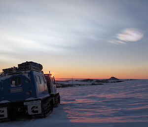 Hagg driving across the ice back into Mawson