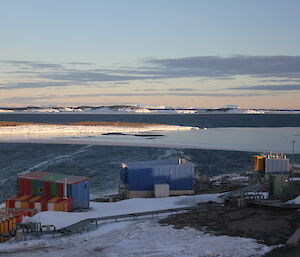 Mawson as seen fro the from Dog Room with a shaft of bright light illuminating some of the buildings